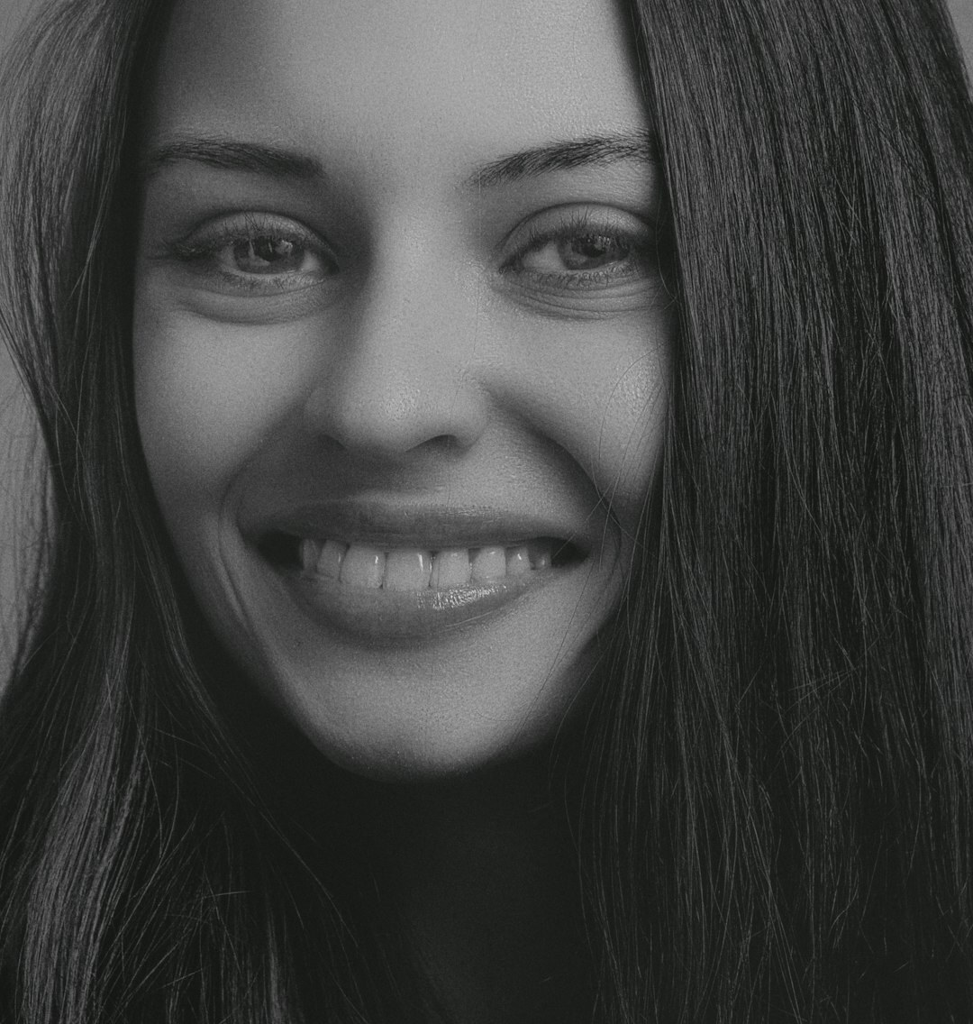 Studio portrait of a smiling woman audience analytics coach