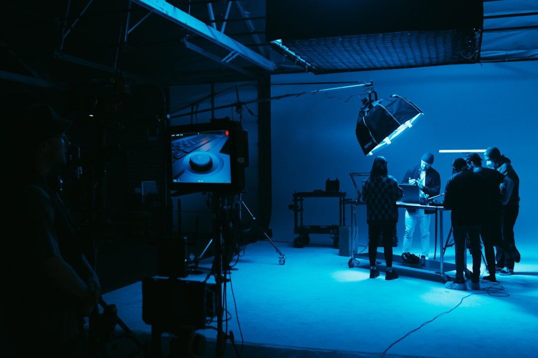 Video production team reviewing live footage together in a studio
