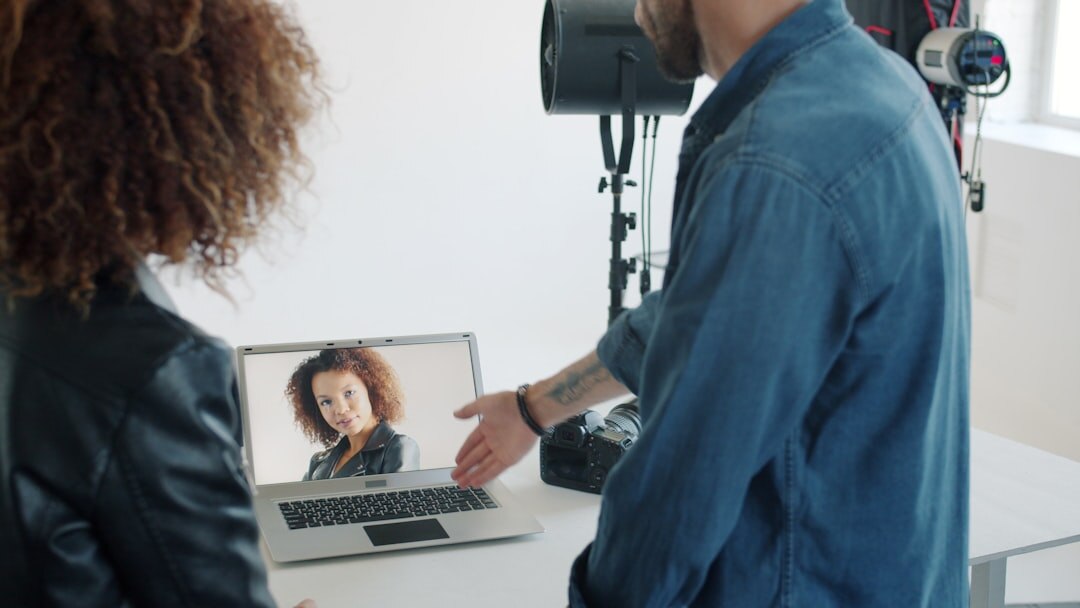 Video team reviewing recorded footage together on a laptop