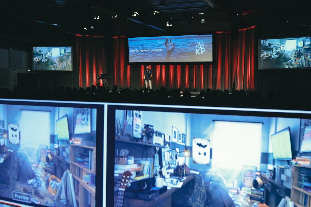 Live broadcast control room with multiple monitors showing a live stream