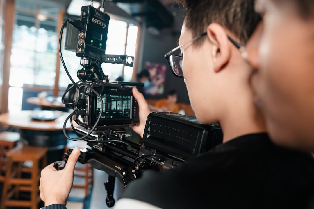Camera operator framing a shot during a live video shoot