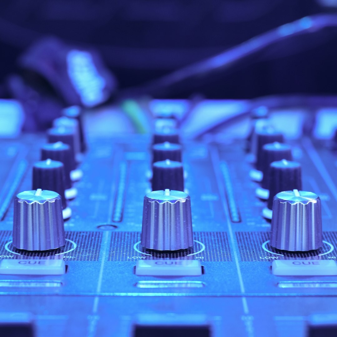 Sound engineer working at an audio mixing console during a live show